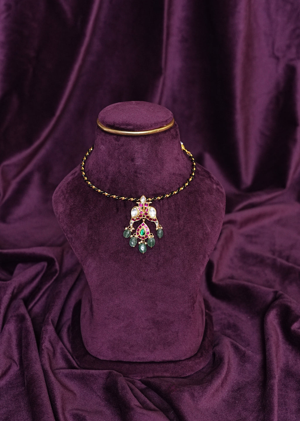 Black Kante Hasli With a Mayil Kundan and Emerald Pendant