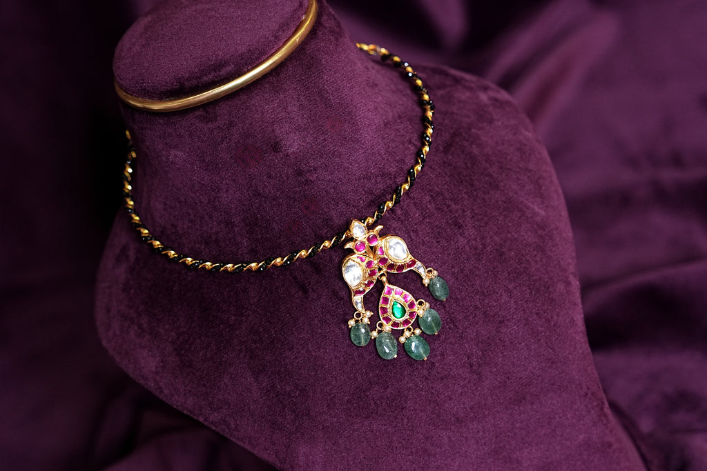 Black Kante Hasli With a Mayil Kundan and Emerald Pendant